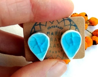 Stud earrings, sterling silver ceramic and turquoise blue crystalline crackled glass, light weight.