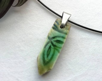 Green ceramic and glass pendant with floral pattern, leaf pendant with pinch bail and black memory wire, ready to gift in organza bag.