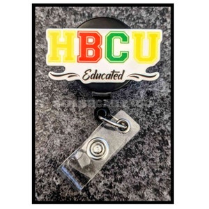 May include: A black retractable badge holder with a yellow, red, and green HBCU logo and the text "Educated".