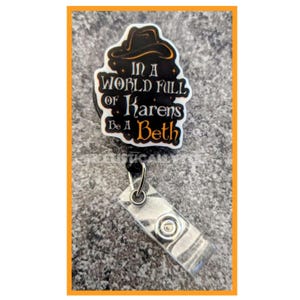 May include: A black and white badge holder with a black witch hat and the text "In a world full of Karens Be a Beth".