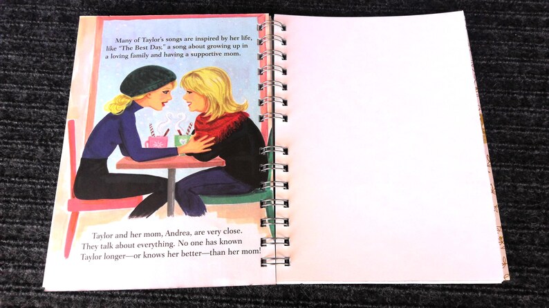 May include: A children's book illustration shows two women at a table, one wearing a black beret and the other with a red scarf. Text on the left page describes the relationship between Taylor and her mom. The right page is blank.