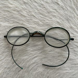 Antique glasses with hook arms