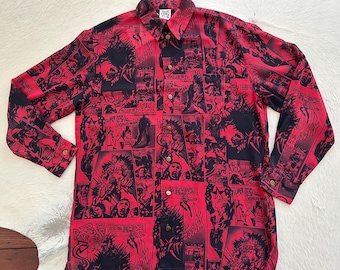 May include: Red button-down shirt with a black comic book print. The long-sleeved shirt features a collage of comic book panels with various characters and speech bubbles. The shirt has a collared neckline and buttoned cuffs.