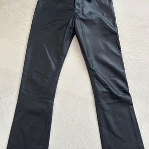 Amazing black leather boot cut trousers from the 90’s