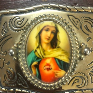 Gold coloured religious belt buckle from mid 1980’s