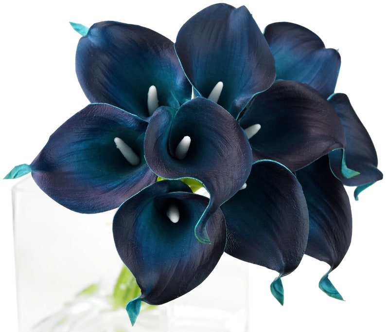May include: A bouquet of teal blue artificial calla lilies. The flowers are arranged in a cluster and have a glossy finish.