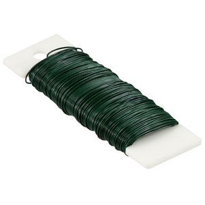 May include: A roll of green floral wire, wrapped in a white plastic spool. The wire is used for crafting and floral arrangements.