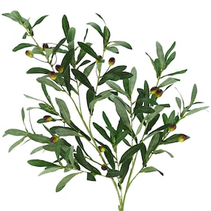 May include: A sprig of artificial olive branches with green leaves and small, dark olives. The leaves are a mix of light and dark green, and the olives have a hint of purple. The branches are arranged against a white background.