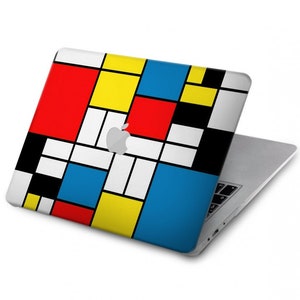 May include: A laptop computer with a geometric design on the lid. The design features squares in red, yellow, blue, and black.