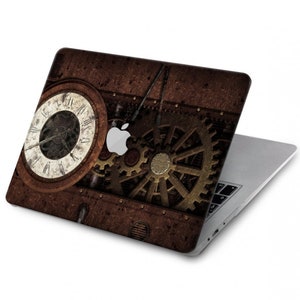 Könnte beinhalten: Ein Laptop mit einem braunen und goldenen Steampunk-Design mit einem Zifferblatt und Zahnrädern. Der Laptop ist geschlossen und das Design befindet sich auf der Oberseite.
