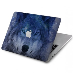 May include: A blue and white laptop skin with a wolf's face design. The wolf's eyes are blue and the background is a galaxy-like pattern.