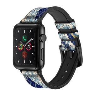 Puede incluir: Un Apple Watch negro con una banda de silicona de patrón de olas azules y blancas. La esfera del reloj es negra con manecillas blancas y una pantalla digital que muestra la hora, la fecha y los iconos de teléfono, música y frecuencia cardíaca.