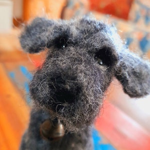 Needle felt scruffy large dog sculpture, grey with blue felt collar and bell detail.