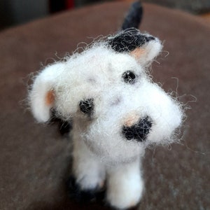 Needlefelted Jack terrier miniature wool sculpture, white with black and brown patches.