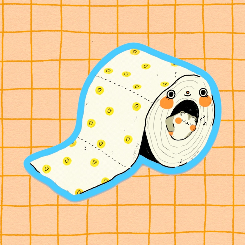 May include: A white toilet roll with yellow dots and a blue border. A small hamster is sleeping inside the roll.