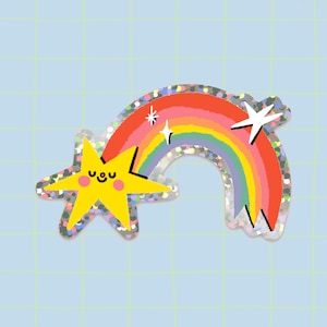 Peut inclure: Une étoile jaune avec un visage souriant traverse un arc-en-ciel avec des accents de paillettes. L'arc-en-ciel a des rayures rouges, orange, jaunes, vertes, bleues, indigo et violettes.