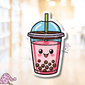 May include: A sticker featuring a cartoon illustration of a pink bubble tea drink with a smiling face. The drink has brown tapioca pearls and a blue lid. The sticker also includes the text "The Sleepy Mug".
