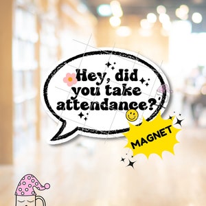 May include: A white magnet with the text "Hey, did you take attendance?" in a black speech bubble. A yellow burst-shaped magnet with the word "MAGNET" is also visible. The image includes a cartoon mug with a sleeping cap.