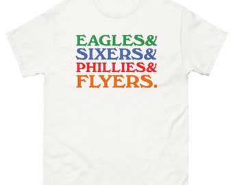 May include: White t-shirt with the text "EAGLES & SIXERS & PHILLIES & FLYERS." in green, blue, red, and orange.