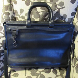 Briefcase | Bugatti black leather messenger bag.
