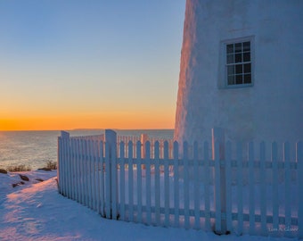 Sunrise close-up of Pemaquid Lighthouse in winter, Monhegan Island in the distance. Photograph printed on canvas.