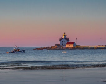 Early morning lobster boat passing Cuckolds Light near Boothbay, Maine. Panorama also available. Photograph printed on canvas.