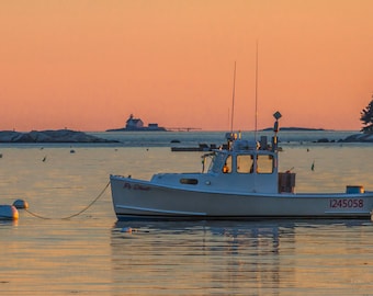 Lobster boat in outer Boothbay Harbor, Cuckolds Lighthouse in the distance. Photograph printed on canvas.