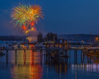 July 4 fireworks over Boothbay Harbor and the iconic footbridge. Photograph printed on canvas.