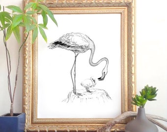 May include: A black and white line drawing of a flamingo standing on a mound with its chick. The flamingo is bending down to feed the chick. The drawing is framed in a gold frame.