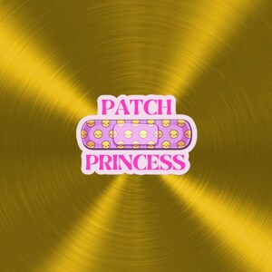 May include: A pink and purple band-aid with a repeating pattern of yellow smiley faces. The band-aid has the text "PATCH PRINCESS" in pink letters.