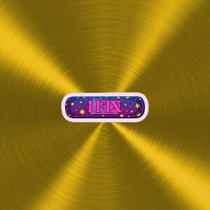 May include: A gold metallic background with a purple and blue button that says "I FIX" in pink letters with yellow stars.