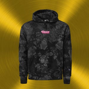 May include: Black tie-dye hoodie with a drawstring hood and a front pocket. The hoodie features the word "Haxor" embroidered in pink across the chest. The hoodie is made of a soft, comfortable material.