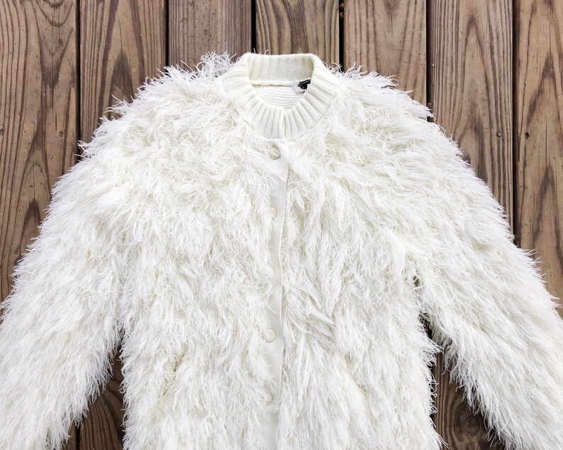 white shaggy coat
