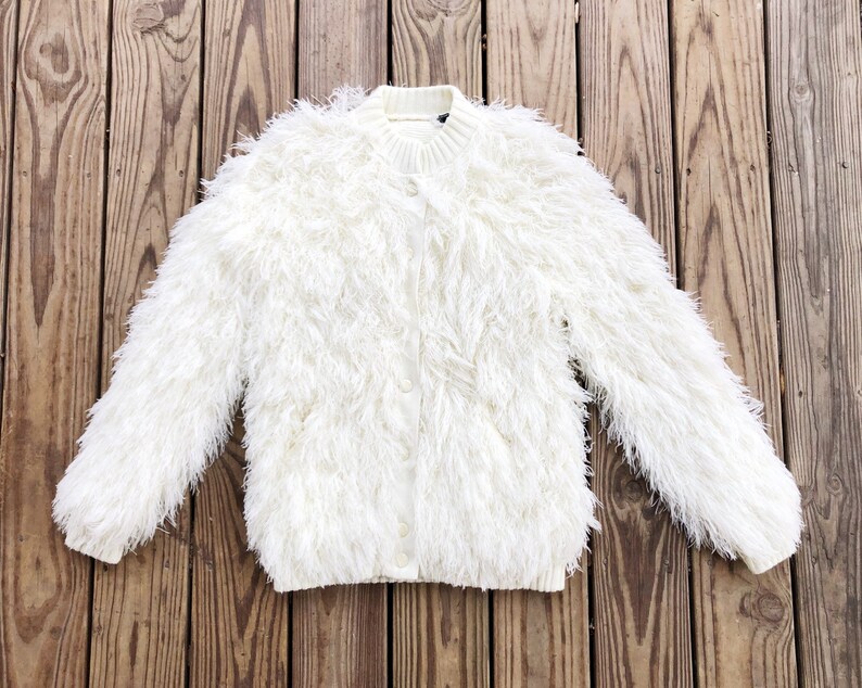 white shaggy jacket