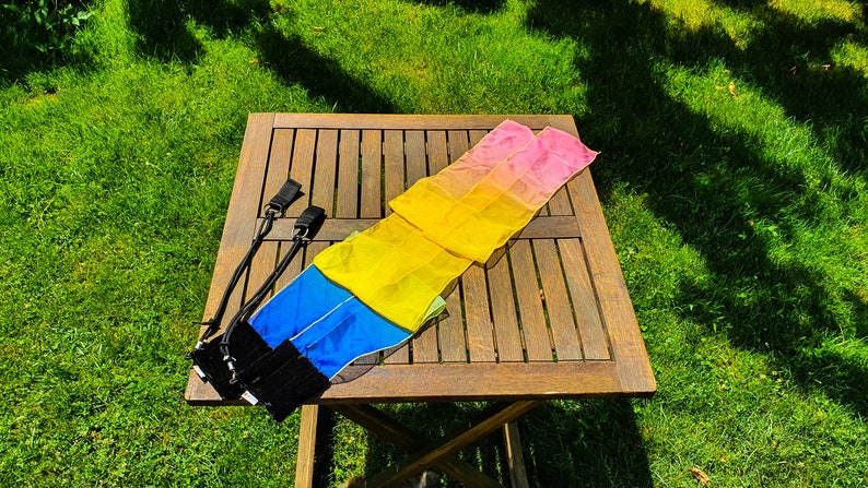 Lightweight ribbon poi pair spinning gracefully for festival performances and practice
