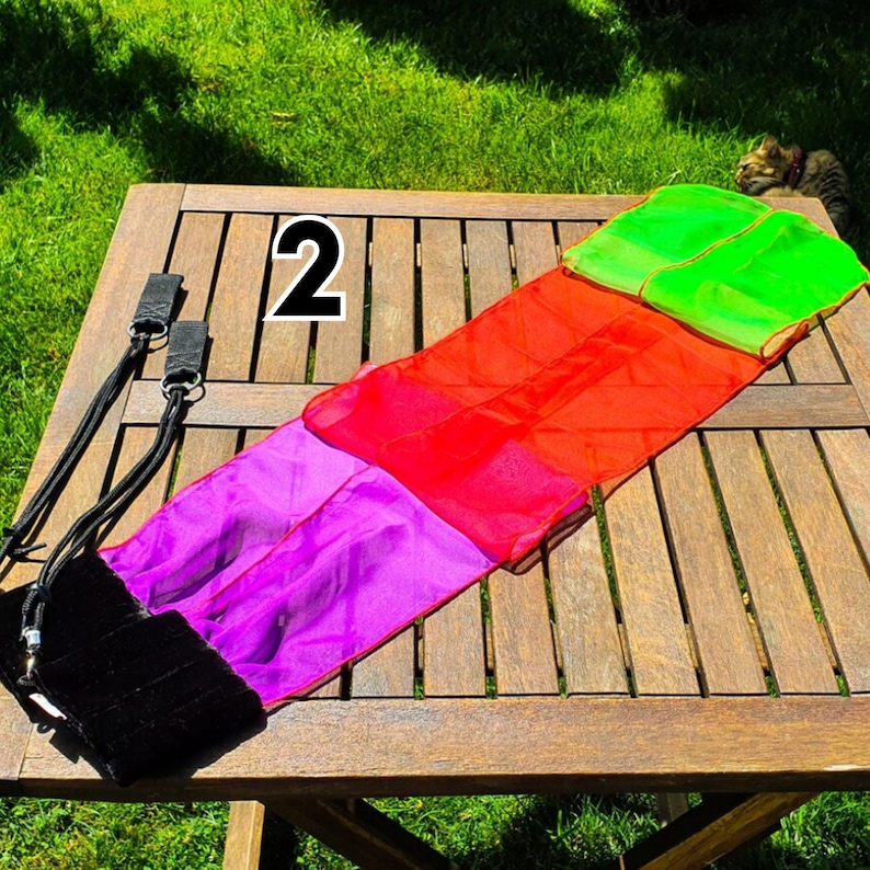 Colorful ribbon poi creating beautiful trails of motion for festival and stage performanc