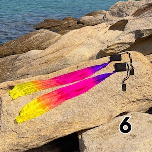wind poi with colorful soft ribbon tails flowing in motion for flow arts and dance