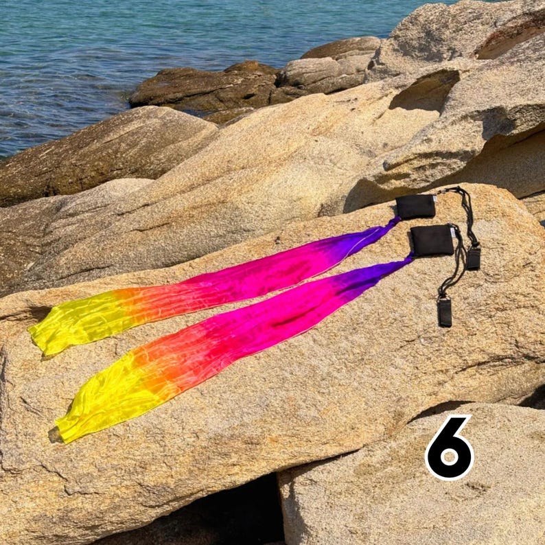 wind poi with colorful soft ribbon tails flowing in motion for flow arts and dance