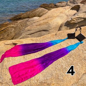 Wind poi pair in motion — handmade lightweight fabric prop for dance and flow arts