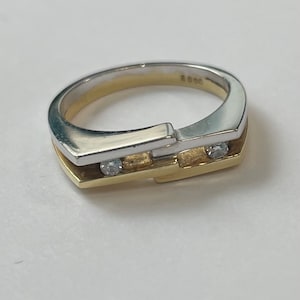 18K yellow and white gold ring with two full cut diamonds
