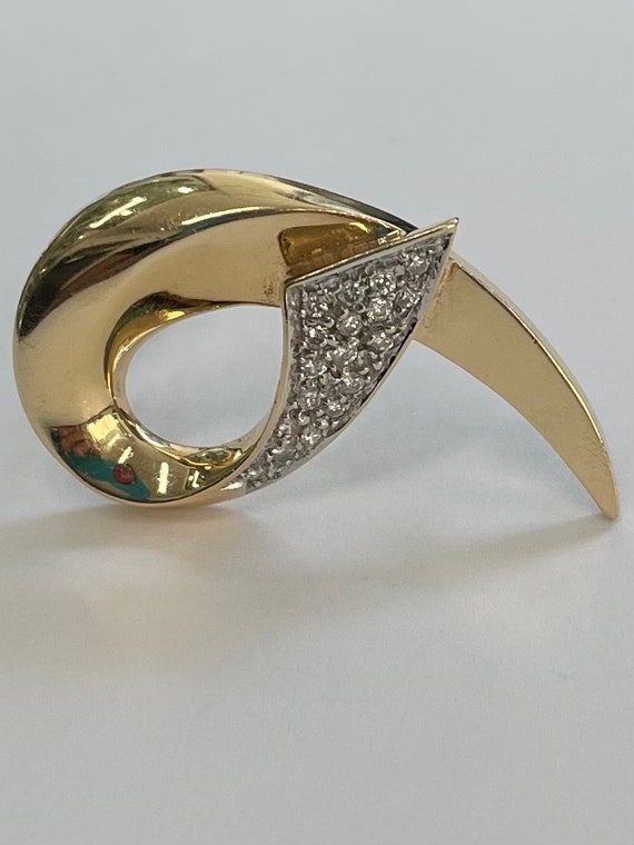 14K gold swirl brooch with diamonds