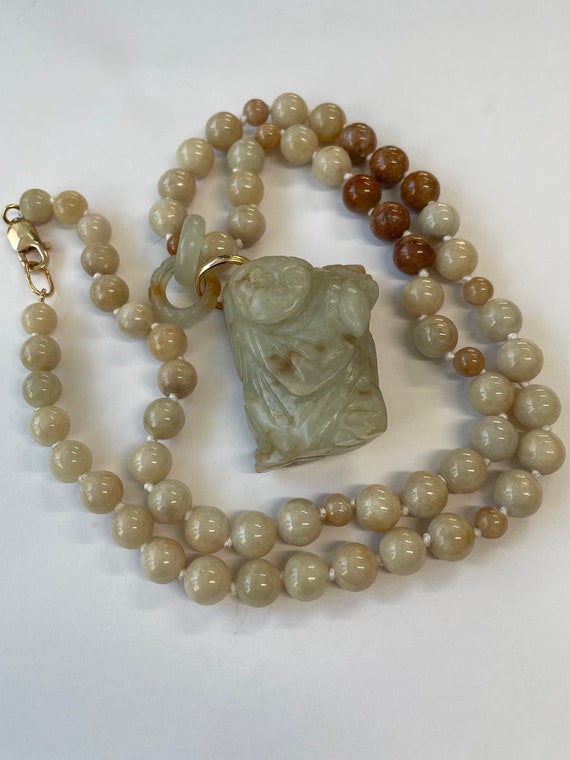 Carved jade pendant on jade beads with 14K ring an