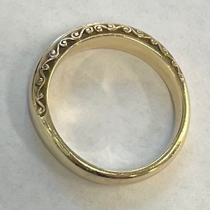14K yellow gold domed band with engraved sides