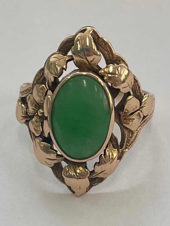 14K gold oval jade ring with floral leaf design - image 1