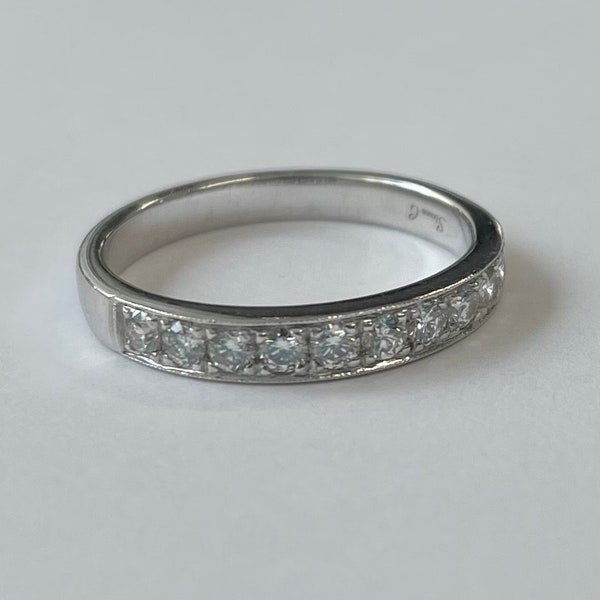 18K white gold band with pave set diamonds across the top by Simon G