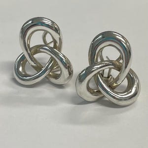 Sterling silver swirl stud earrings by Angela Cummings
