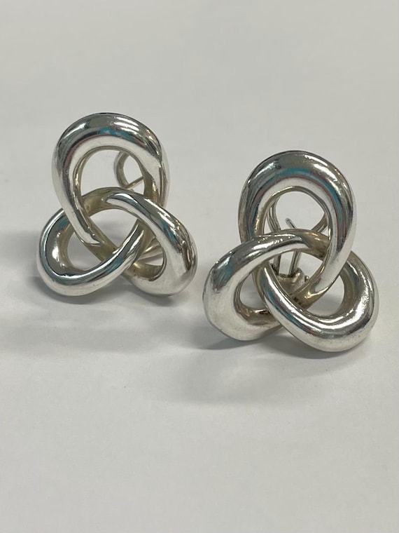 Sterling silver swirl stud earrings by Angela Cummings