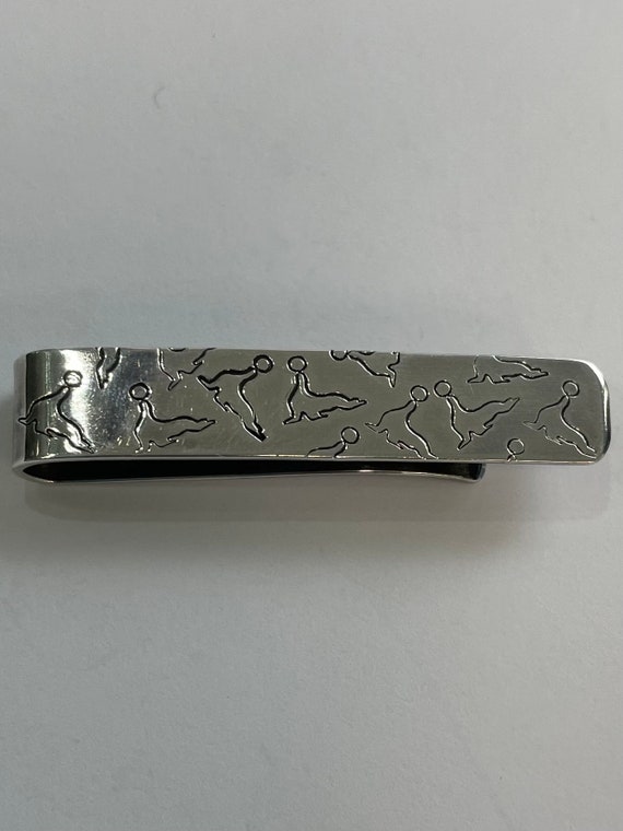 Sterling silver seals tie clip by modernist Henry 