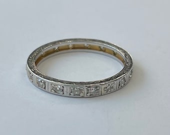 Platinum band with gold accent inside and diamonds