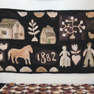 May include: A black and white hooked rug with a variety of images including houses, a horse, a tree, a flower, and two figures. The rug is dated 1882.